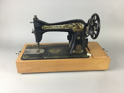 Lot 497 - A CASED SINGER SEWING MACHINE