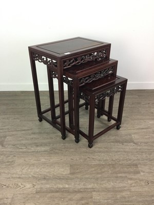 Lot 500 - A CHINESE ROSEWOOD NEST OF THREE TABLES