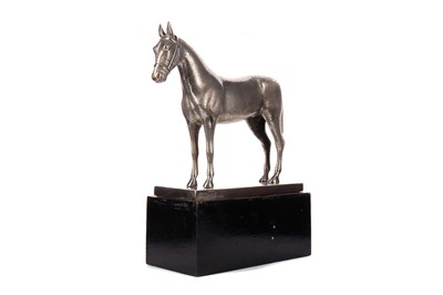 Lot 526 - AN EARLY 20TH CENTURY WHITE METAL MODEL OF A HORSE