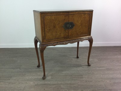 Lot 511 - A REPRODUCTION WALNUT DRINKS CABINET