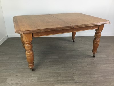 Lot 411 - A VICTORIAN OAK EXTENDING DINING TABLE