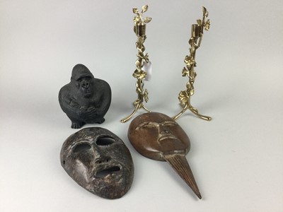 Lot 544 - A PAIR OF BRASS CANDLESTICKS ALONG WITH TWO AFRICAN MASKS