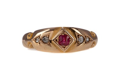 Lot 1455 - A SYNTHETIC RUBY AND DIAMOND THREE STONE RING