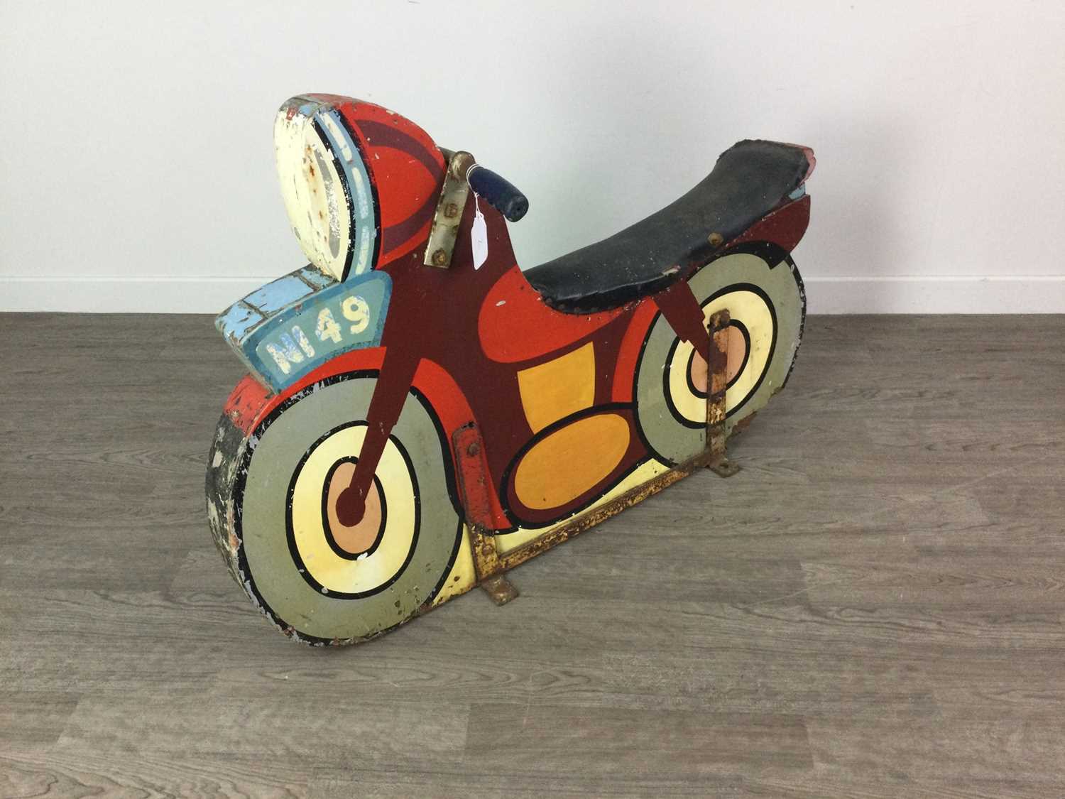 Lot 1141 - A PAINTED WOOD FAIRGROUND RIDE MOTORBIKE