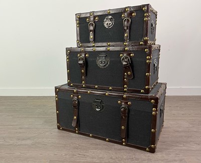 Lot 133 - A SET OF THREE GRADUATED STUDDED LEATHER BOUND SUITCASES