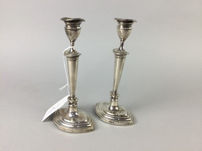 Lot 41 - A PAIR OF SILVER CANDLESTICKS