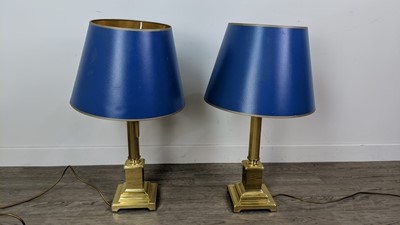 Lot 208 - A PAIR OF BRASS COLUMN TABLE LAMPS WITH BLUE SHADES