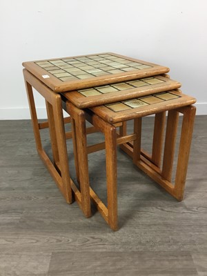 Lot 226 - A NEST OF THREE TEAK TABLES AND A MAGAZINE RACK