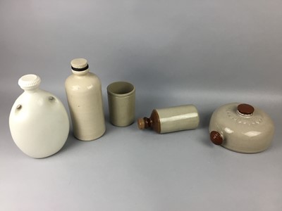 Lot 181 - A LOT OF FIVE STONEWARE HOT WATER BOTTLES AND A JAR