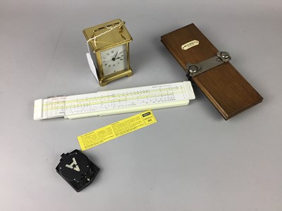 Lot 259 - A MILITARY POCKET COMPASS, CARRIAGE CLOCK, RULE AND PRESS