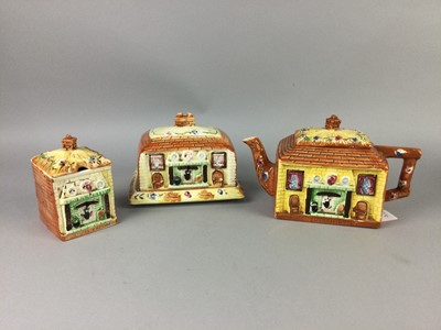 Lot 112 - A COTTAGE WARE TEAPOT, BUTTER DISH AND PRESERVE JAR ALONG WITH TWO GLUG JUGS