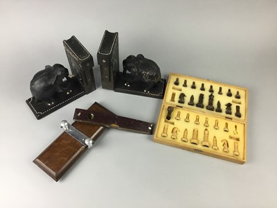 Lot 174 - A MOULDED GLASS CHESS SET, A TIE PRESS AND OTHER ITEMS