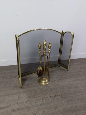 Lot 420 - A BRASS FIREGUARD AND COMPANION STAND