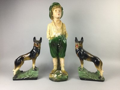 Lot 350 - A PAIR OF PLASTER FIGURES OF ALSATIANS ALONG WITH A FIGURE OF THE WHISTLING BOY