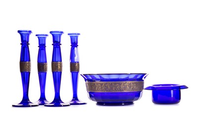 Lot 789 - A SET OF FOUR ‘BRISTOL’ BLUE CANDLESTICKS WITH TWO BOWLS
