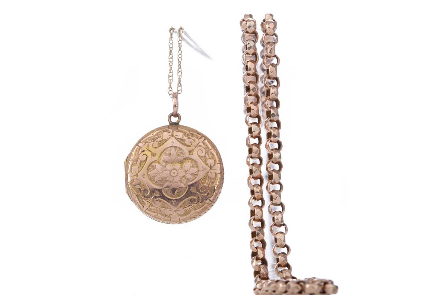 Lot 427 - A GOLD LOCKET ON CHAIN AND ANOTHER CHAIN