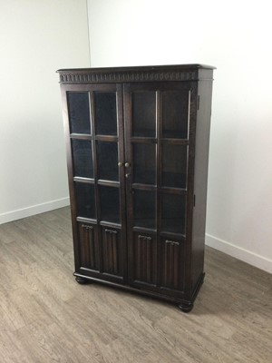 Lot 586 - AN OAK GLAZED BOOKCASE