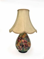 Lot 1179 - LARGE MOORCROFT TABLE LAMP with tube-lined...