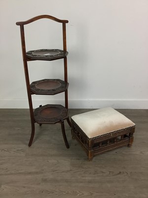 Lot 577 - A CARVED THREE TIER CAKESTAND AND A FOOTSTOOL