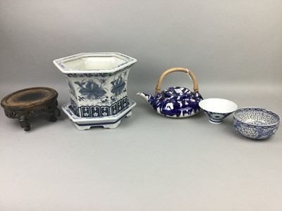 Lot 39 - A CHINESE BLUE AND WHITE PLANTER AND STAND, ALONG WITH A TEAPOT AND TWO BOWLS