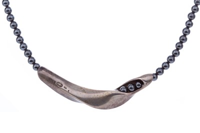 Lot 420 - A GEORG JENSEN SILVER AND HEMATITE NECKLACE AND RING