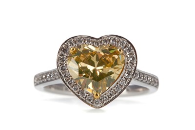 Lot 465 - AN IMPRESSIVE GIA CERTIFICATED YELLOW HEART SHAPED DIAMOND RING