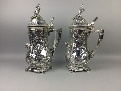Lot 32 - A PAIR OF CONTINENTAL SILVER PLATED TANKARDS