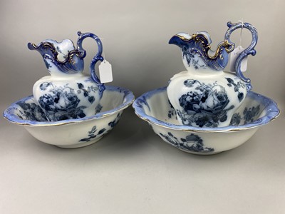 Lot 265 - A PAIR OF VICTORIAN BLUE AND WHITE CERAMIC EWERS AND WASH BASINS