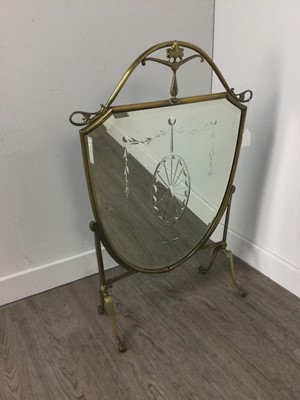 Lot 376 - A LATE VICTORIAN MIRRORED BRASS FIRESCREEN