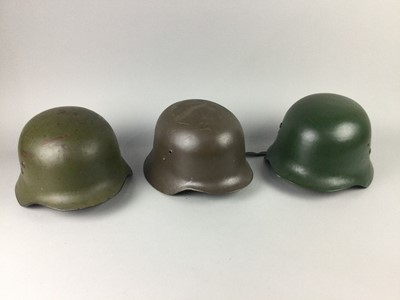 Lot 338 - FOUR WWII GERMAN STYLE STEEL HELMETS