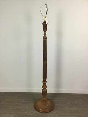 Lot 430 - AN EASTERN CARVED STANDARD LAMP