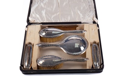 Lot 57 - A GEORGE V SILVER MOUNTED DRESSING TABLE SET