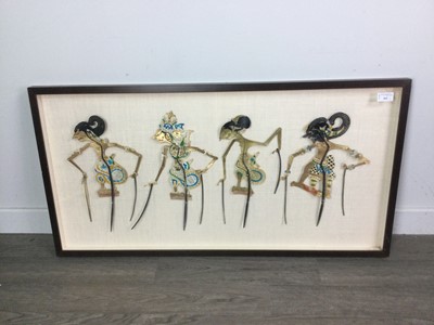 Lot 462 - A FRAMED PRESENTATION OF FOUR WAYANG KULIT PUPPETS ALONG WITH TWO OTHER PICTURES