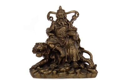 Lot 1104 - A CHINESE HOLLOW CAST BRASS FIGURE GROUP