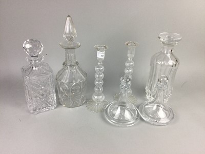 Lot 526 - A PAIR OF GLASS CANDLESTICKS AND GLASS DECANTERS