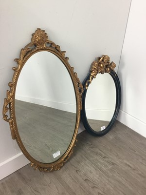 Lot 543 - AN OVAL WALL MIRROR AND ANOTHER