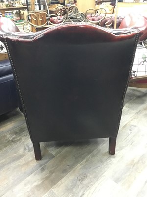Lot 511 - A CHESTERFIELD OXBLOOD LEATHER WINGBACK ARMCHAIR