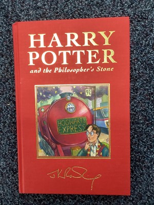 Lot 973 - A FULL SET OF HARRY POTTER FIRST DELUXE EDITIONS