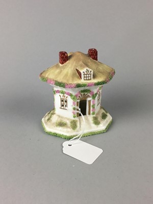 Lot 618 - A REPRODUCTION PASTILLE BURNER AND AN ONYX TABLE LAMP