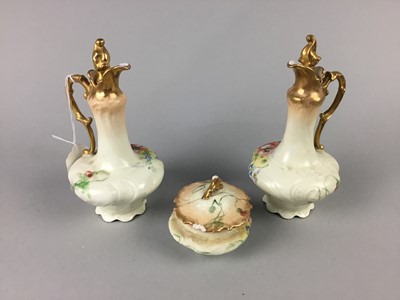 Lot 628 - A FLORAL DECORATED CERAMIC DRESSING TABLE SET