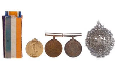 Lot 19 - THREE WWI SERVICE MEDALS AND A CAP BADGE