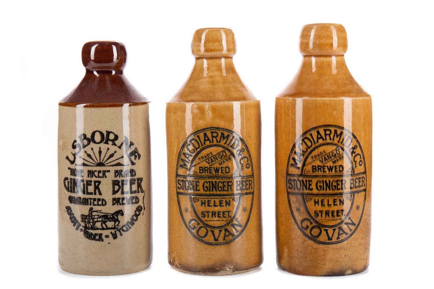 Lot 827 - A GROUP OF THREE STONEWARE GINGER BEER BOTTLES