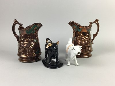 Lot 571 - A LOT OF TWO COPPER LUSTRE JUGS ALONG WITH TWO COW CREAMERS