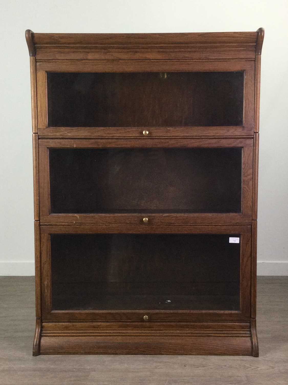 Lot 730 - AN EARLY 20TH CENTURY OAK SECTIONAL BOOKCASE