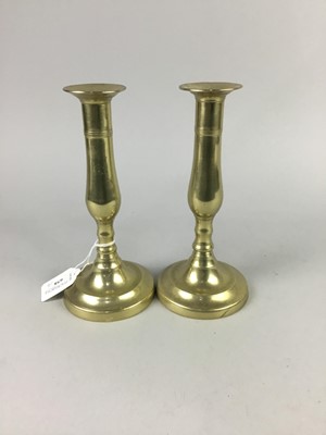 Lot 658 - A PAIR OF BRASS CANDLESTICKS