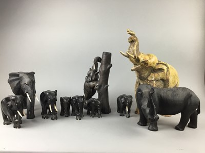 Lot 666 - AN AFRICAN HARDWOOD CARVING OF AN ELEPHANT ALONG WITH NINE OTHER FIGURES