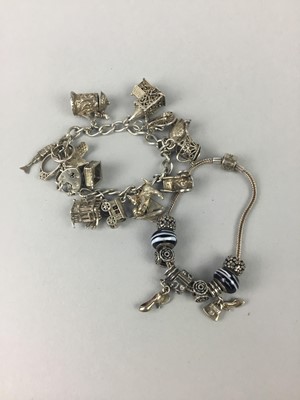 Lot 22 - A SILVER CHARM BRACELET AND ANOTHER