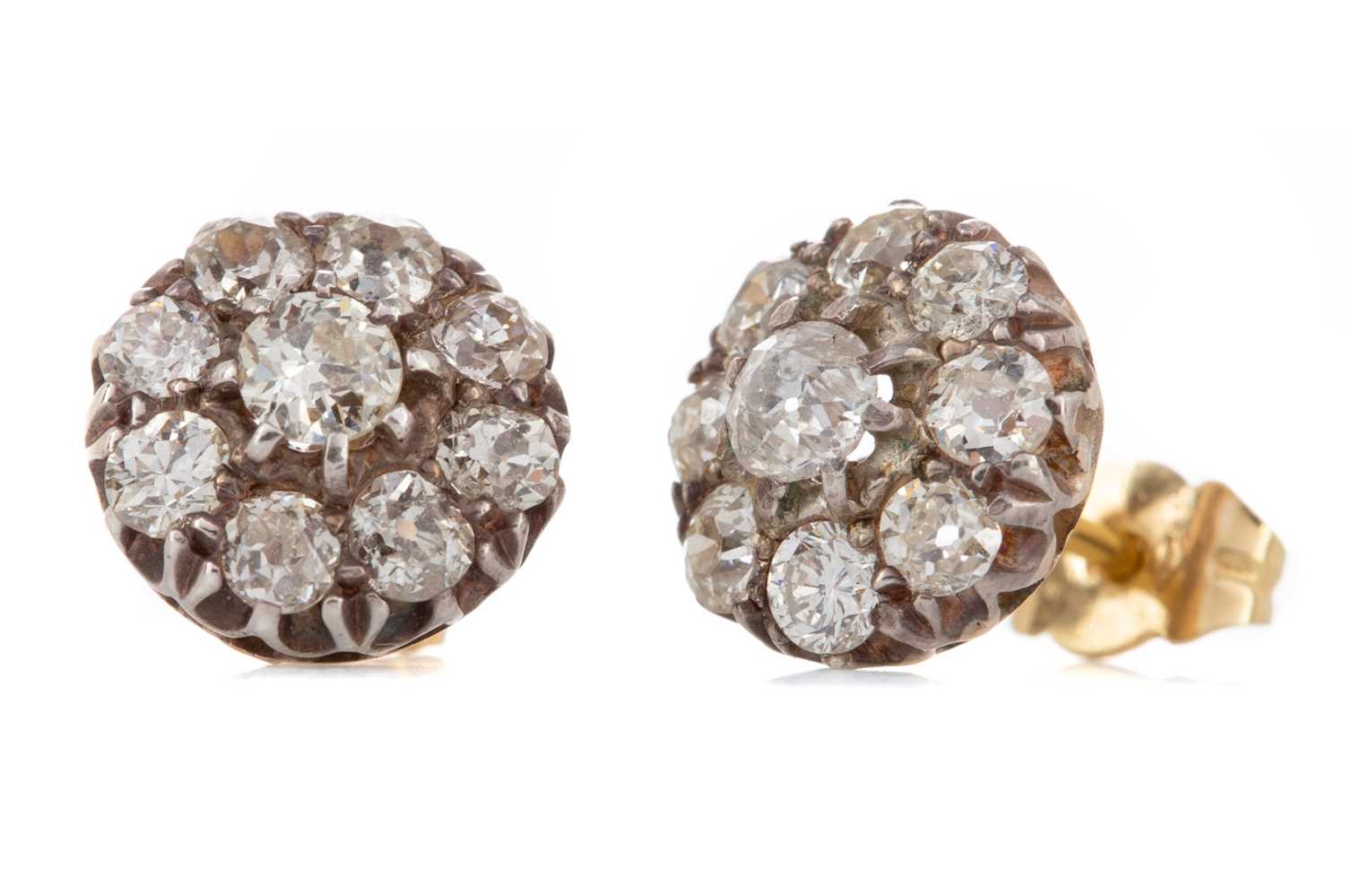 Lot 1228 - A PAIR OF DIAMOND CLUSTER EARRINGS
