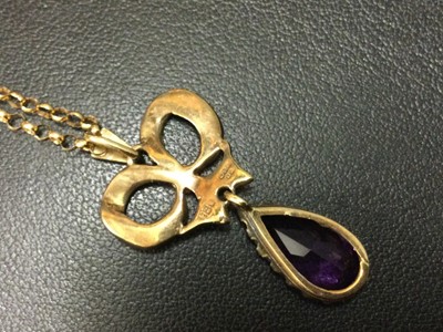Lot 1209 - AN AMETHYST AND PEARL PENDANT