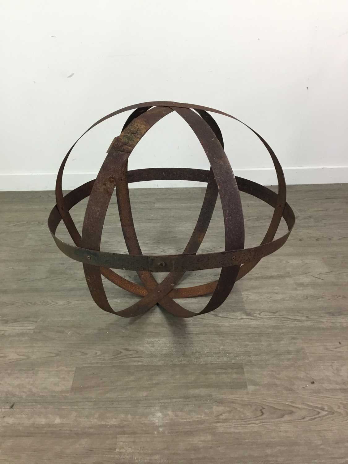 Lot 99 A METAL ORB GARDEN SCULPTURE FORMED BY WHISKY